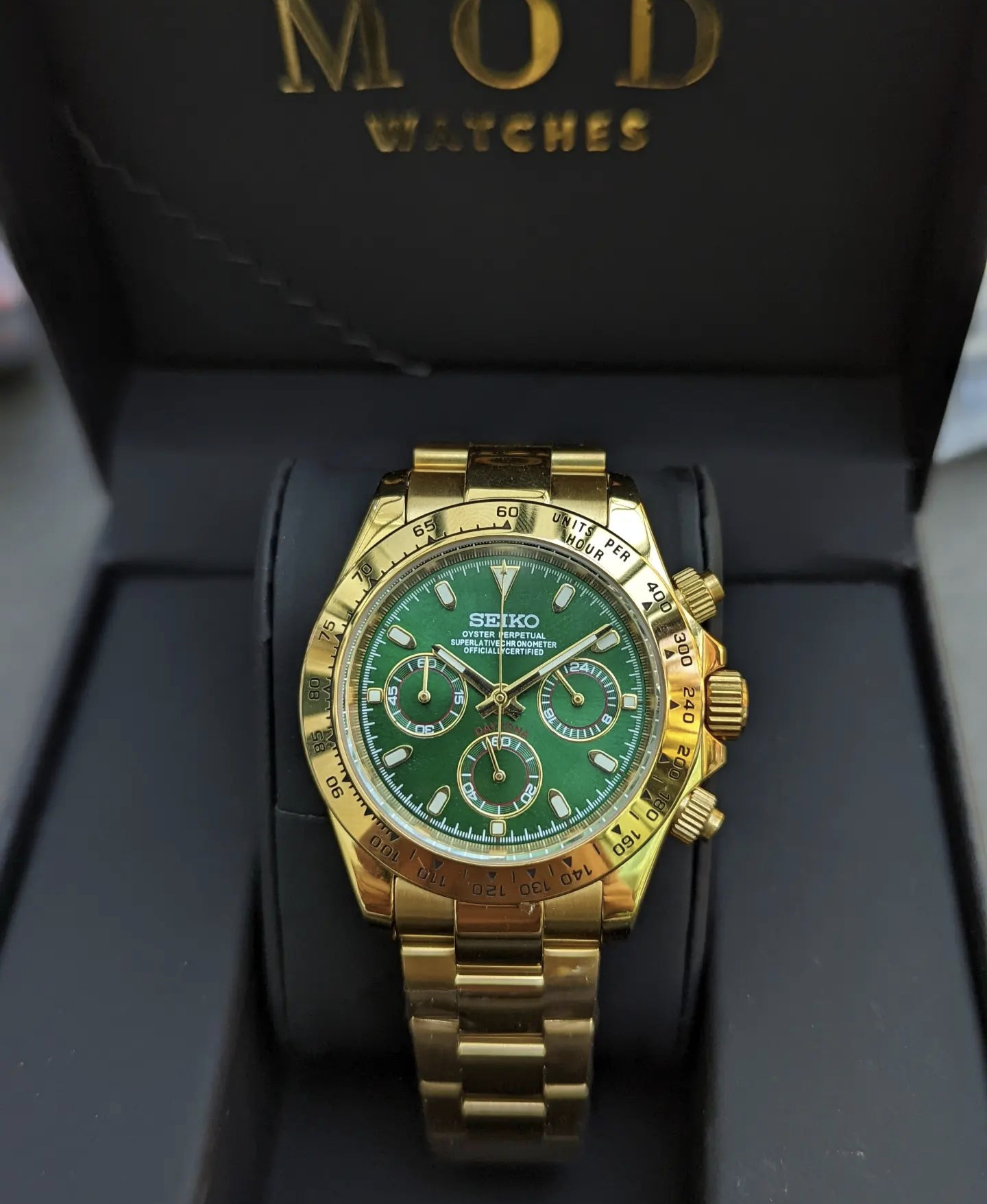 Gold daytona hotsell green face